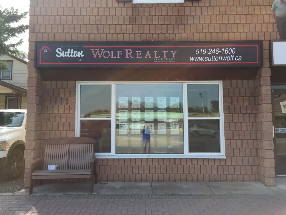 Sutton Wolf Realty — Exterior business signage